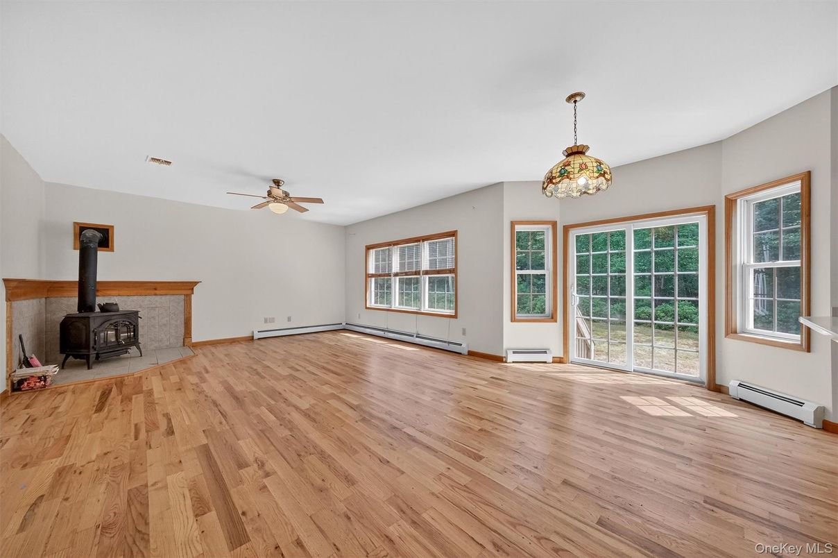 Empty room, Fireplace, Interior, Pendant Lights, Wood Texture Flooring