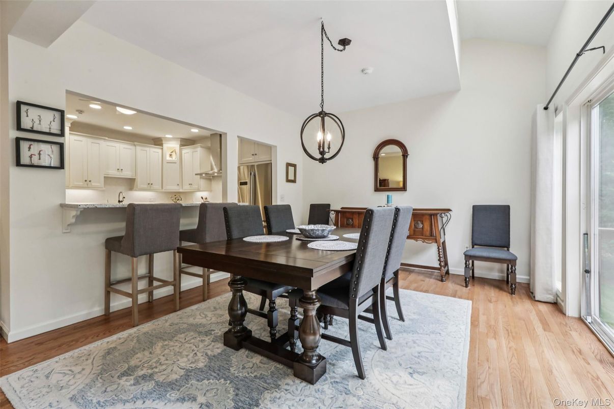 Chandelier, Dining room, Interior, Kitchen, Pendant Lights, Recessed Lighting, Stainless Steel Appliances, Wood Texture Flooring