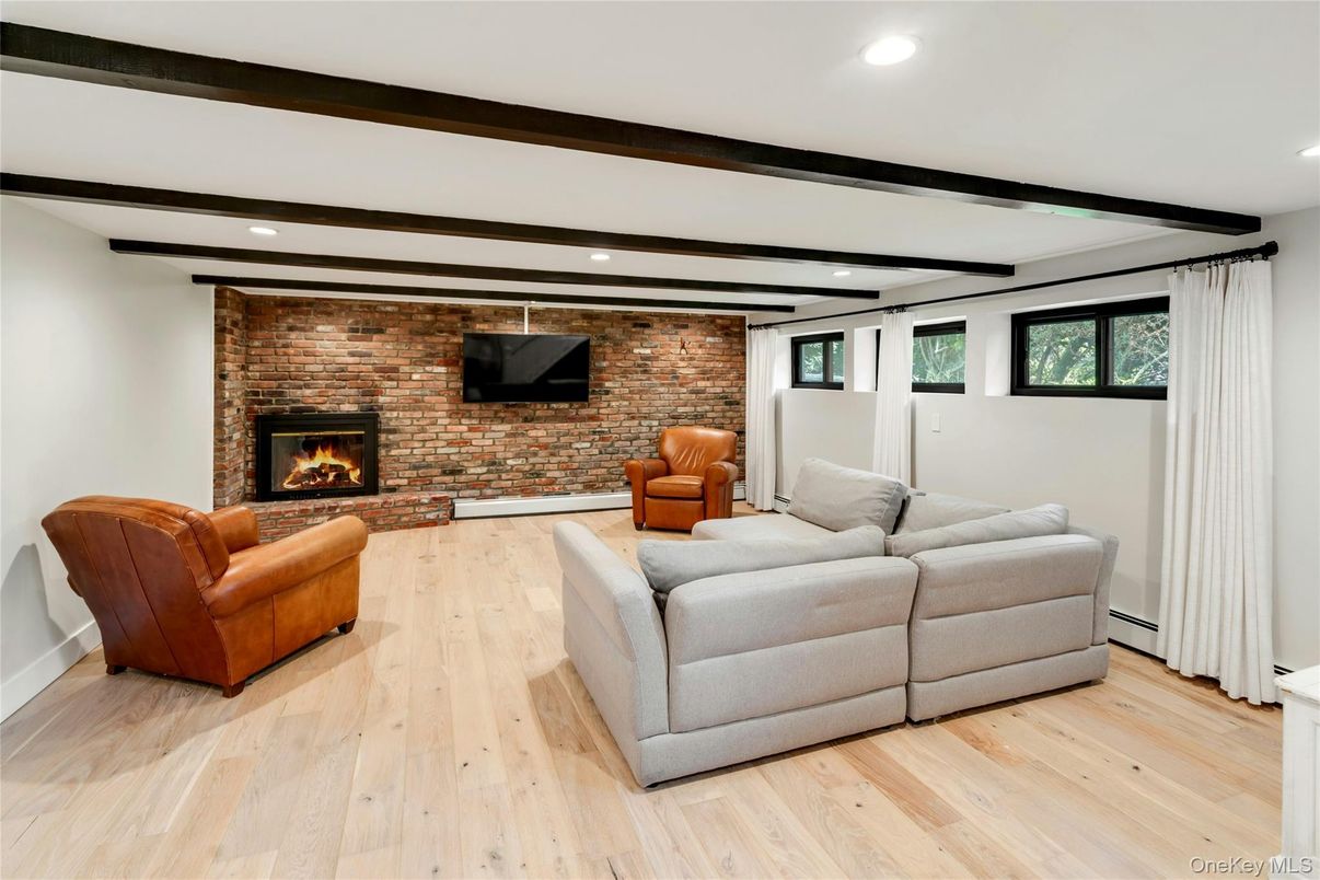 Fireplace, Interior, Living room, Recessed Lighting, Stone Walls, Wood Texture Flooring