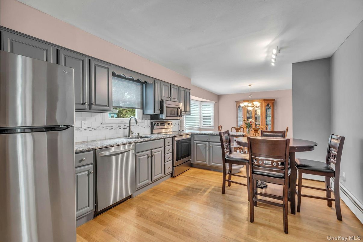 Chandelier, Dining room, Interior, Kitchen, Stainless Steel Appliances, Wood Texture Flooring