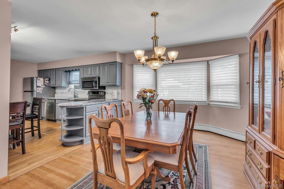 Chandelier, Dining room, Interior, Kitchen, Stainless Steel Appliances, Wood Texture Flooring