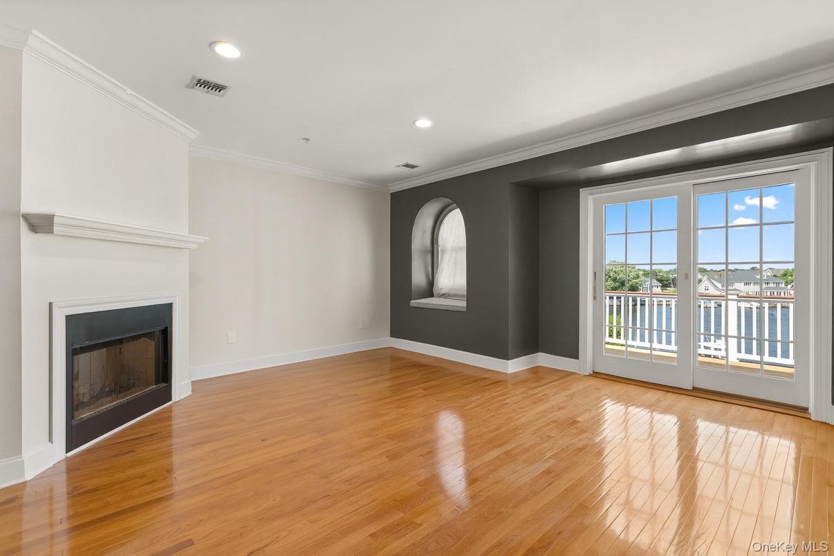 Empty room, Fireplace, Interior, Recessed Lighting, Water, Wood Texture Flooring