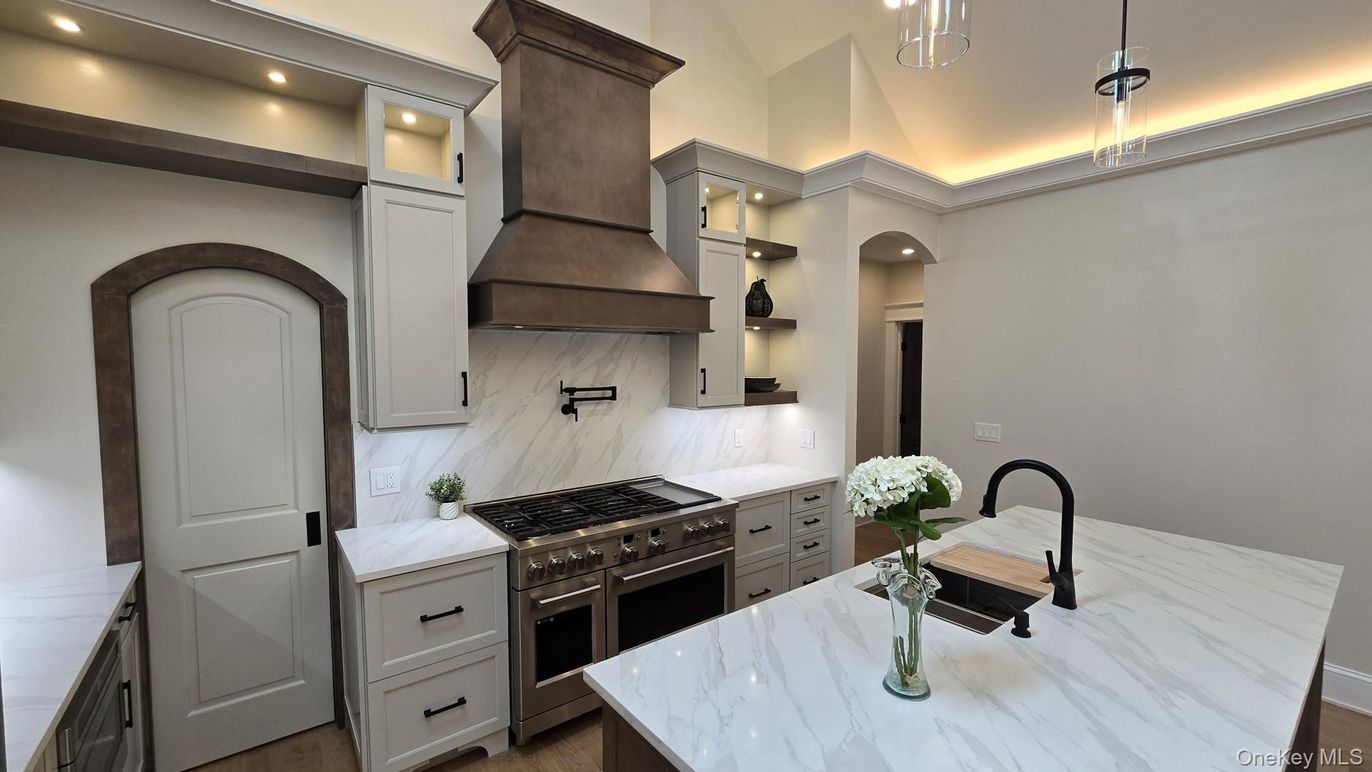 Interior, Kitchen, Marble Walls, Pendant Lights, Recessed Lighting, Stainless Steel Appliances, Wood Texture Flooring
