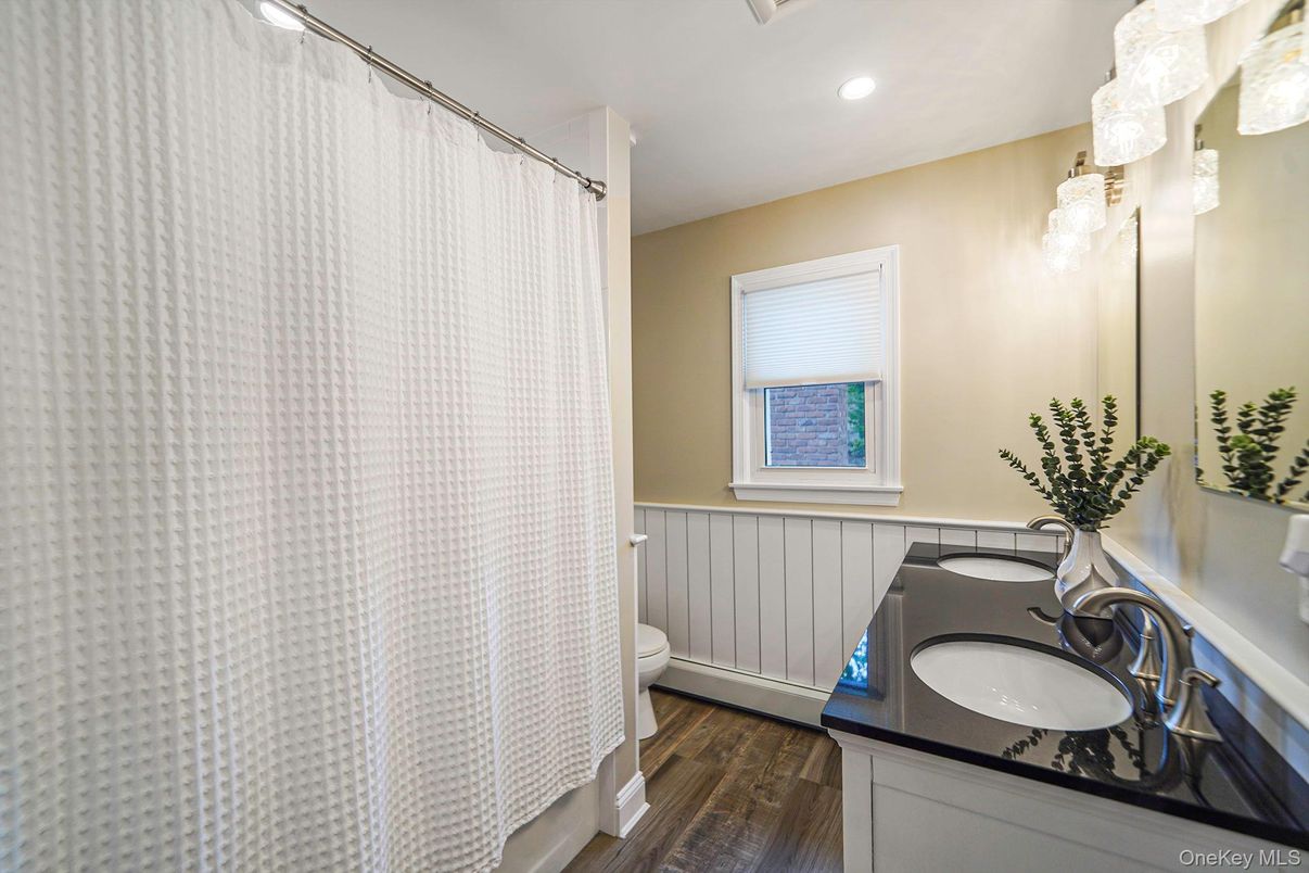 Bathroom, Dual Sink Vanities, Interior, Recessed Lighting, Wood Texture Flooring