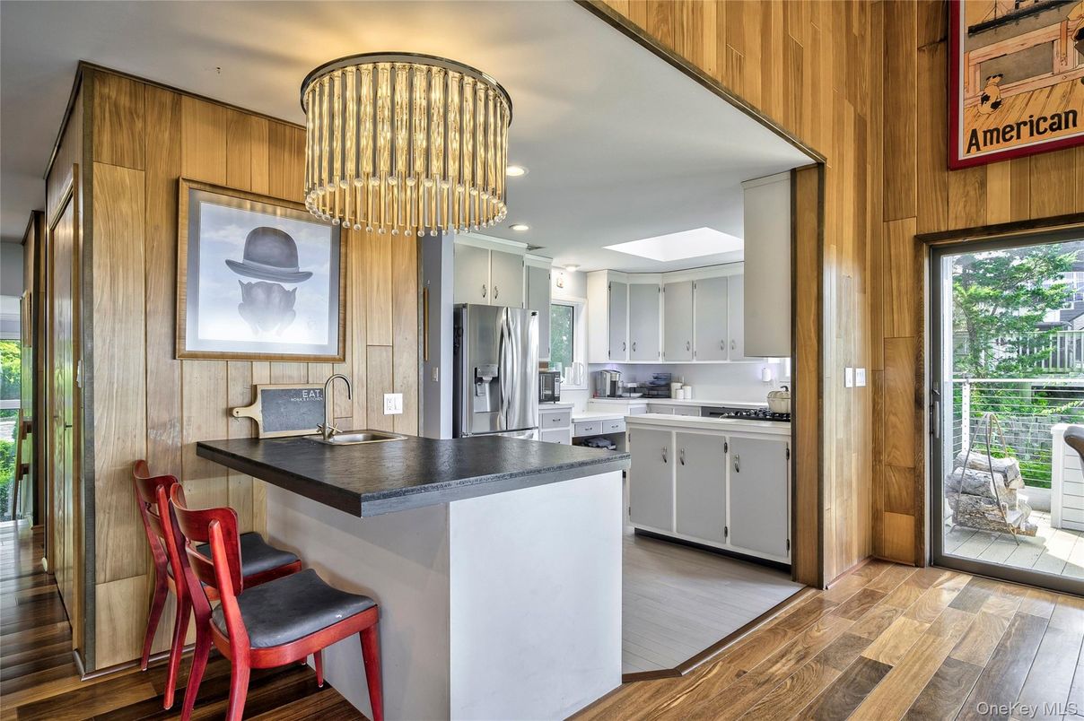 Chandelier, Interior, Kitchen, Recessed Lighting, Stainless Steel Appliances, Wood Texture Flooring, Wooden Walls