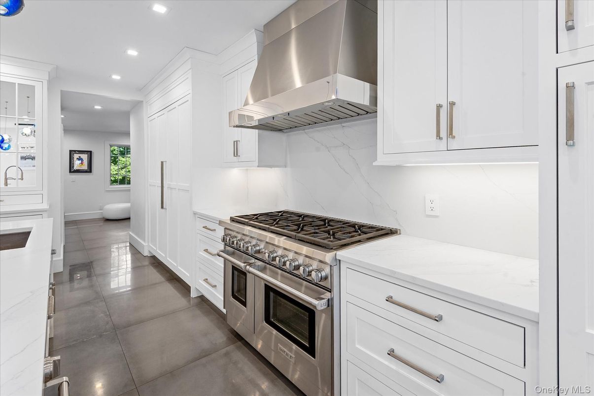 Interior, Kitchen, Marble Walls, Recessed Lighting, Stainless Steel Appliances