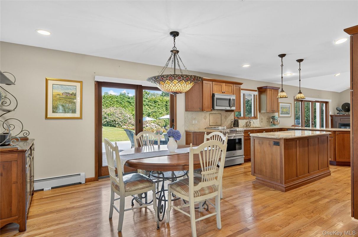 Dining room, Interior, Kitchen, Pendant Lights, Recessed Lighting, Stainless Steel Appliances, Wood Texture Flooring