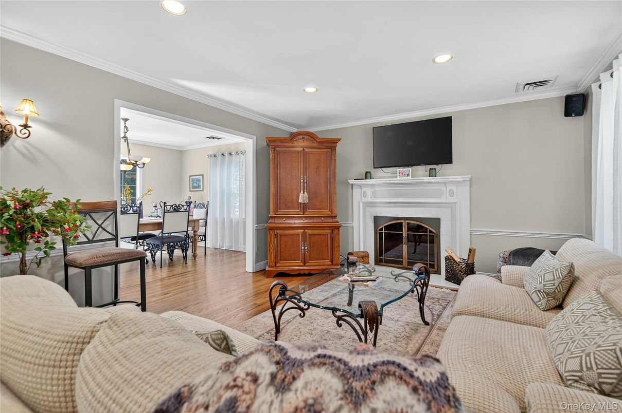 Dining room, Fireplace, Interior, Living room, Recessed Lighting, Wood Texture Flooring
