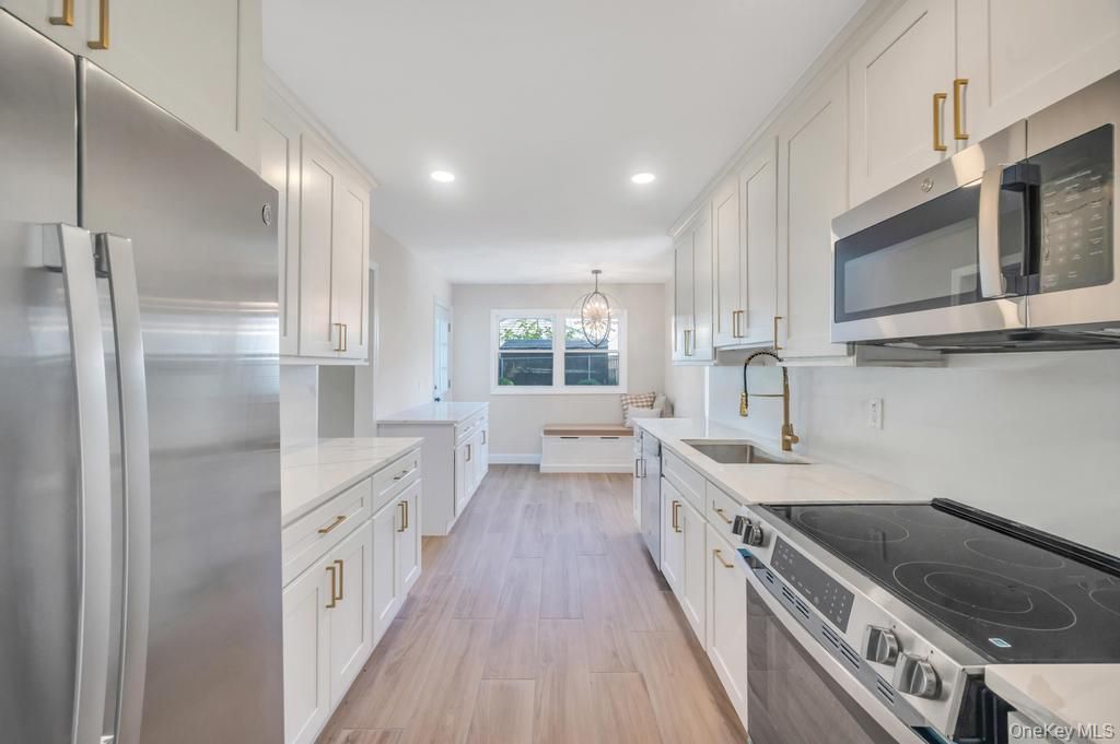 Chandelier, Interior, Kitchen, Pendant Lights, Recessed Lighting, Stainless Steel Appliances, Wood Texture Flooring