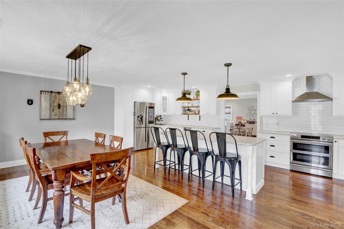 Dining room, Interior, Kitchen, Pendant Lights, Recessed Lighting, Stainless Steel Appliances, Wood Texture Flooring