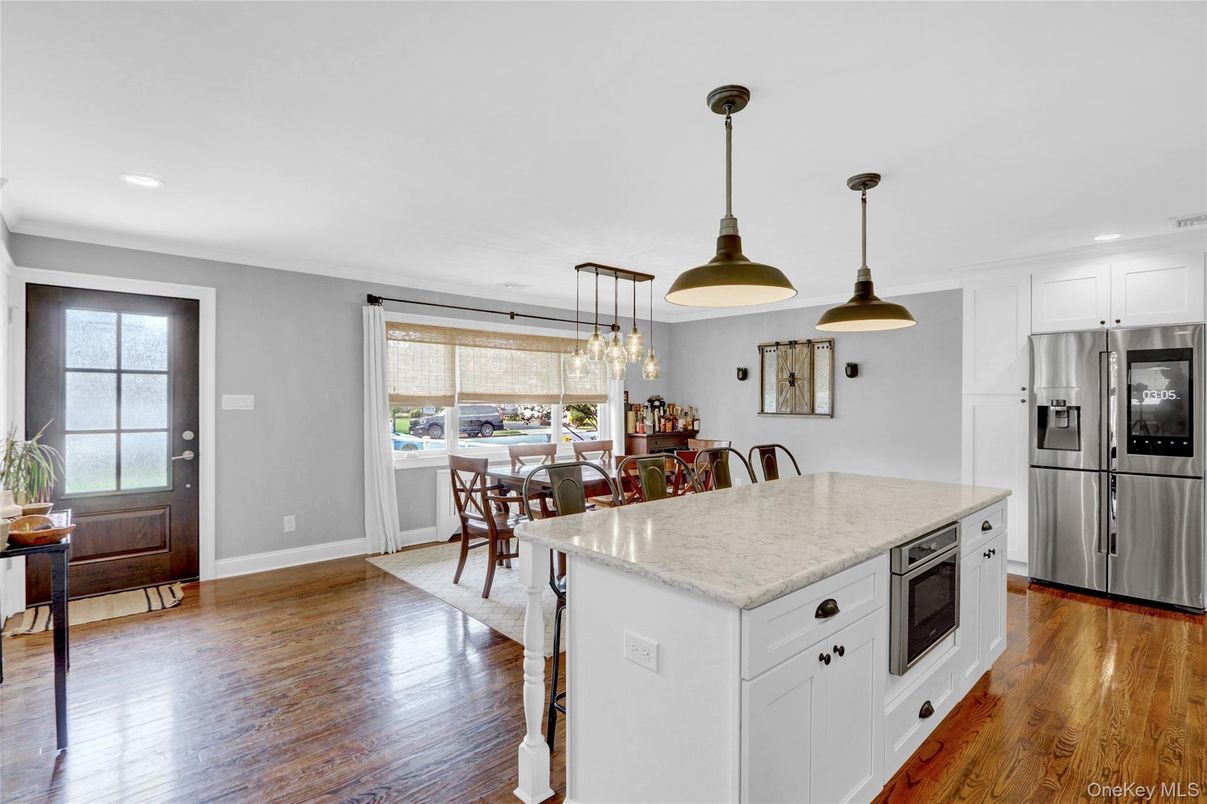 Dining room, Interior, Kitchen, Pendant Lights, Recessed Lighting, Stainless Steel Appliances, Wood Texture Flooring