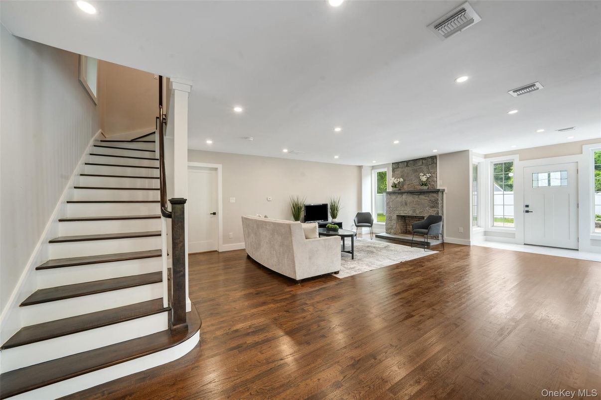 Fireplace, Interior, Living room, Recessed Lighting, Stone Walls, Wood Texture Flooring
