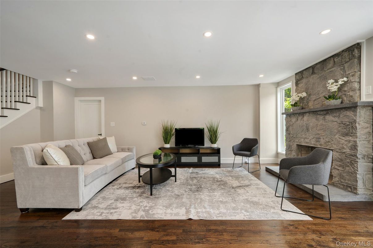 Fireplace, Interior, Living room, Recessed Lighting, Stone Walls, Wood Texture Flooring