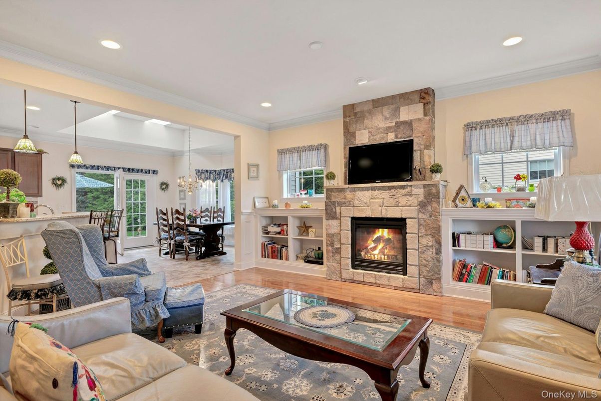 Dining room, Fireplace, Interior, Living room, Pendant Lights, Recessed Lighting, Wood Texture Flooring