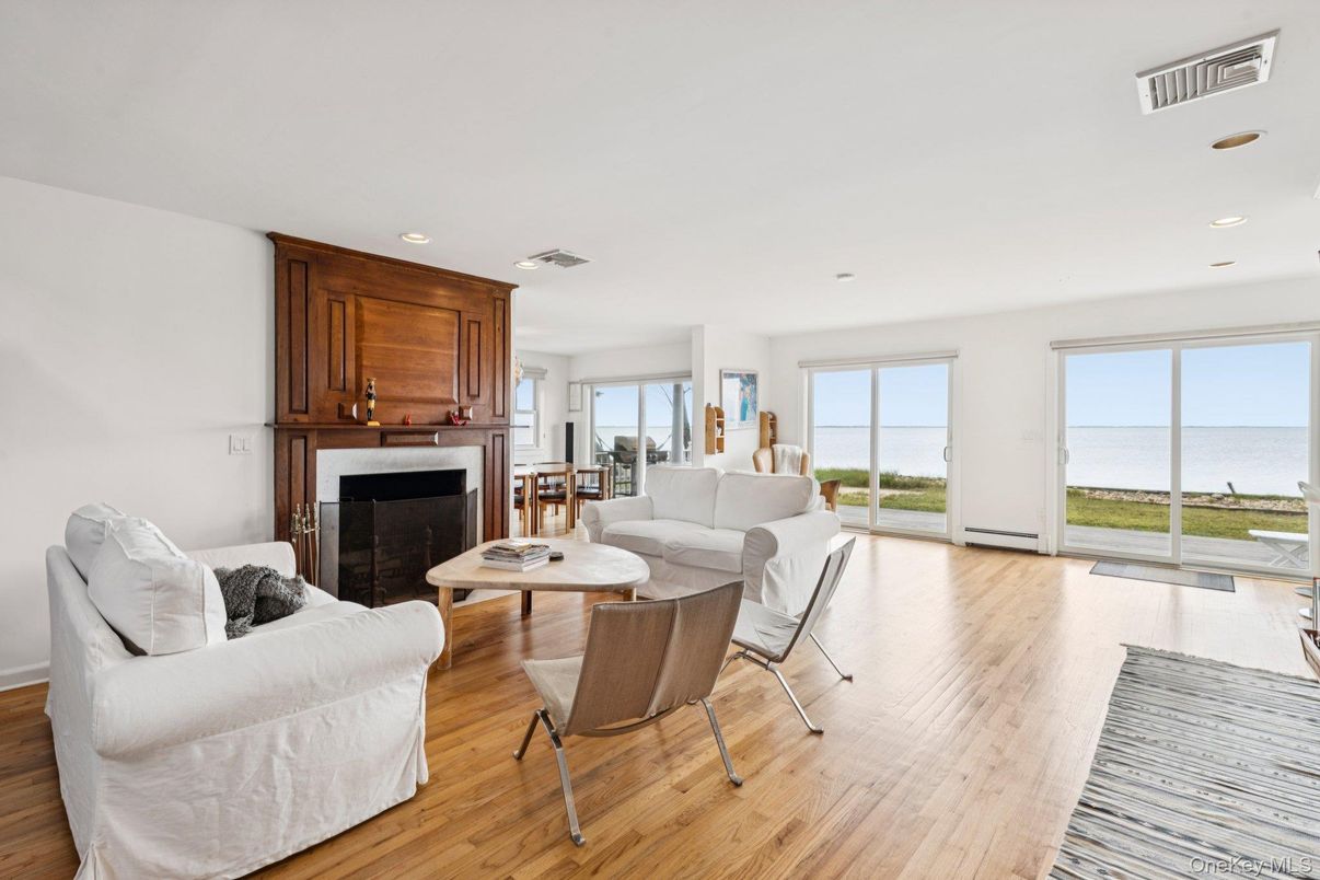 Fireplace, Interior, Living room, Recessed Lighting, Water, Wood Texture Flooring