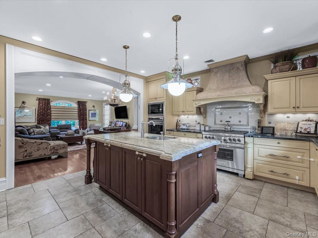 Chandelier, Interior, Kitchen, Living room, Pendant Lights, Recessed Lighting, Stainless Steel Appliances, Wood Texture Flooring