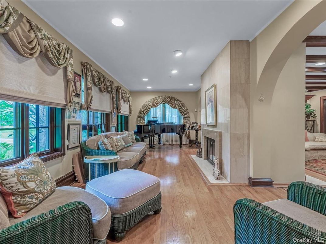 Fireplace, Interior, Living room, Piano, Recessed Lighting, Wood Texture Flooring