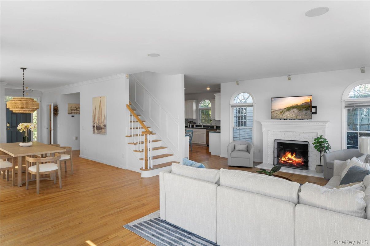 Dining room, Fireplace, Interior, Living room, Pendant Lights, Recessed Lighting, Wood Texture Flooring