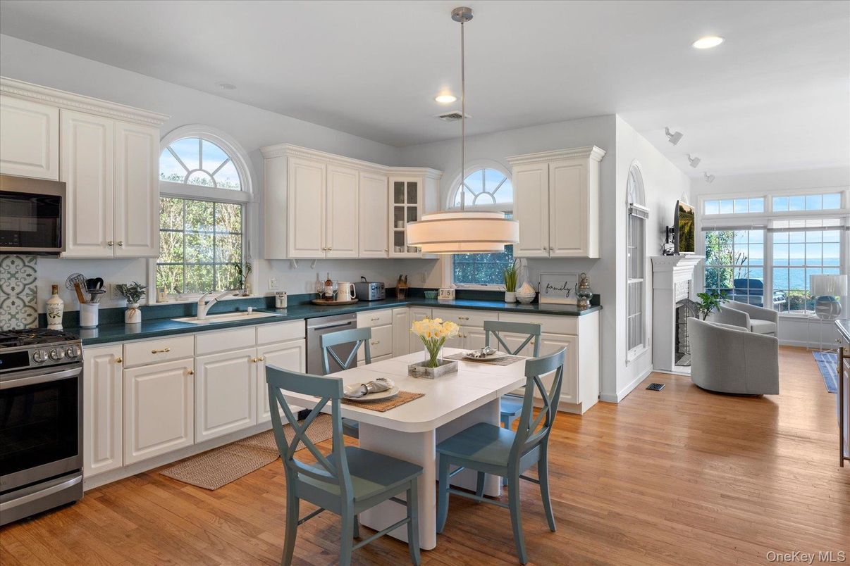 Dining room, Fireplace, Interior, Kitchen, Living room, Pendant Lights, Recessed Lighting, Water, Wood Texture Flooring