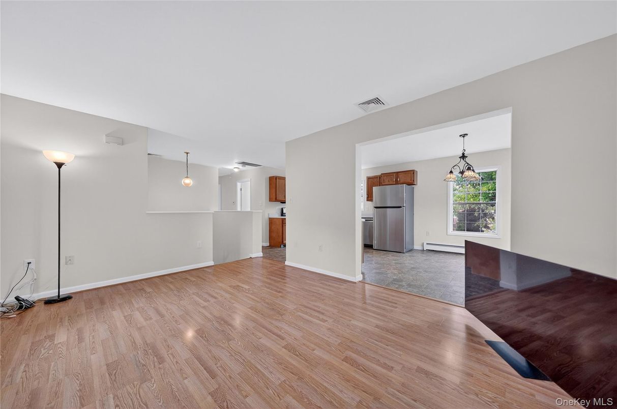 Empty room, Interior, Kitchen, Pendant Lights, Stainless Steel Appliances, Wood Texture Flooring