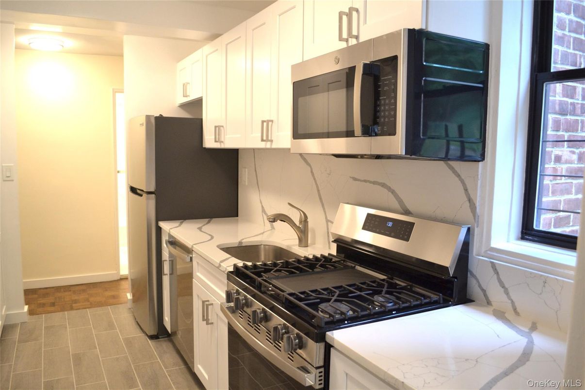 Interior, Kitchen, Marble Walls, Stainless Steel Appliances, Wood Texture Flooring