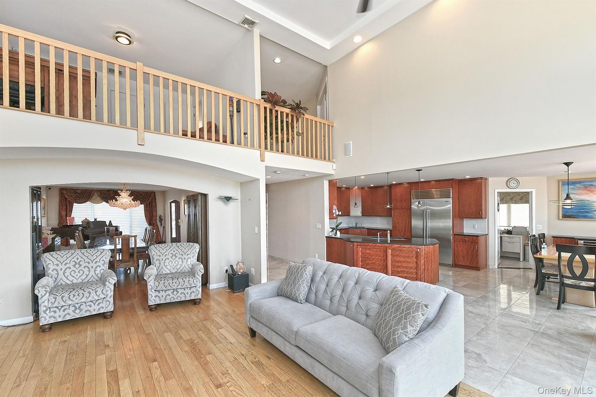 Dining room, Interior, Kitchen, Living room, Recessed Lighting, Stainless Steel Appliances, Wood Texture Flooring