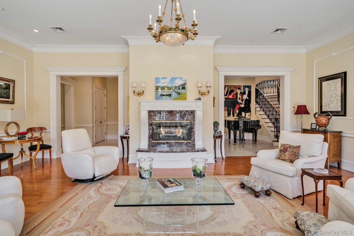 Chandelier, Fireplace, Interior, Living room, Piano, Recessed Lighting, Wood Texture Flooring