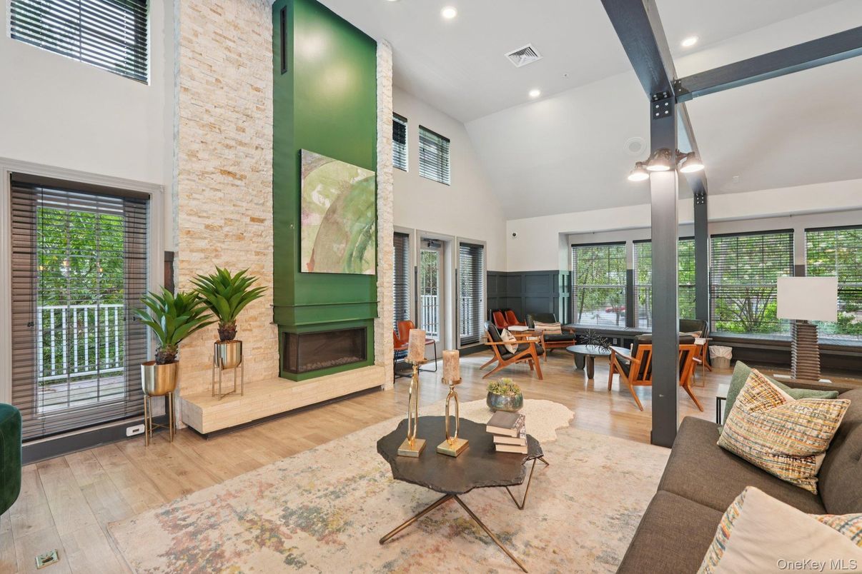 Dining room, Fireplace, Interior, Living room, Recessed Lighting, Stone Walls, Wood Texture Flooring