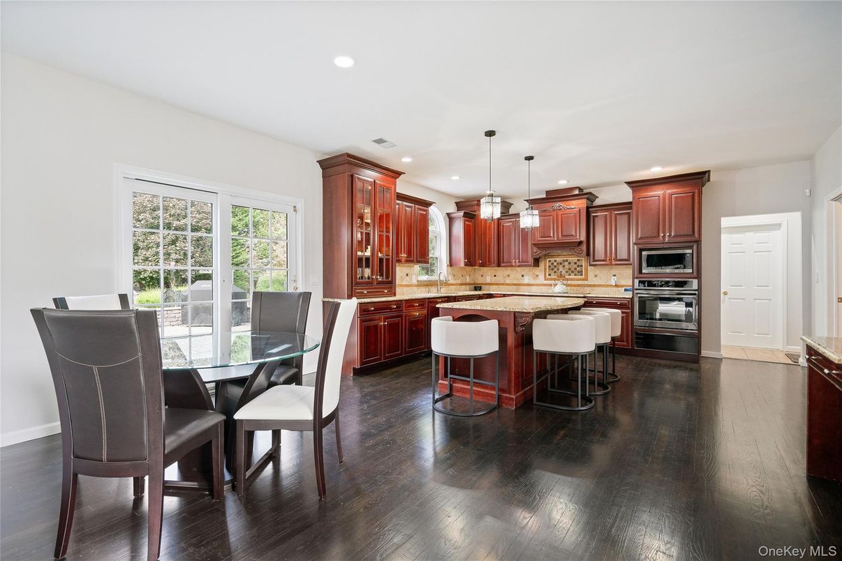 Dining room, Interior, Kitchen, Pendant Lights, Recessed Lighting, Stainless Steel Appliances, Wood Texture Flooring