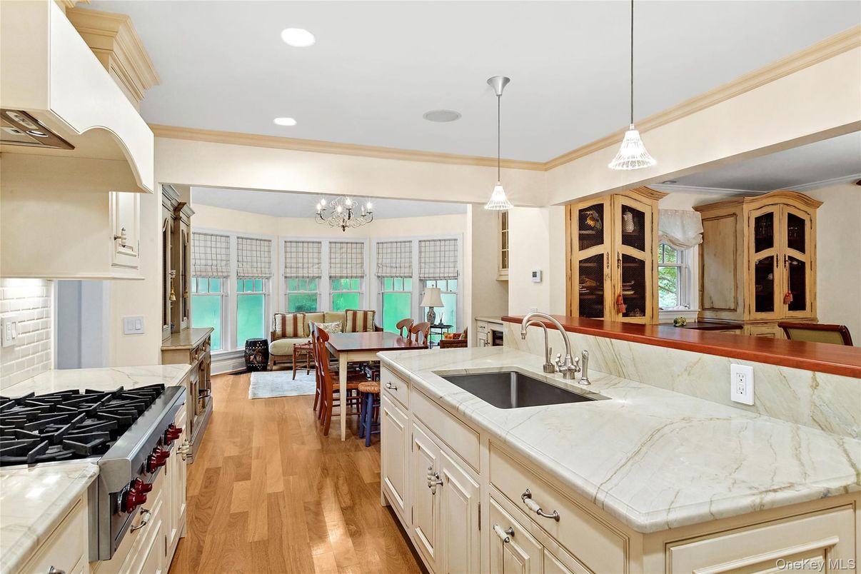 Chandelier, Dining room, Interior, Kitchen, Living room, Pendant Lights, Recessed Lighting, Wood Texture Flooring