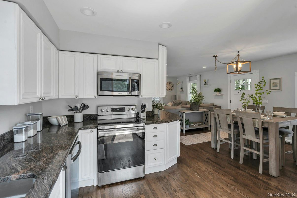 Dining room, Interior, Kitchen, Living room, Pendant Lights, Recessed Lighting, Stainless Steel Appliances, Wood Texture Flooring