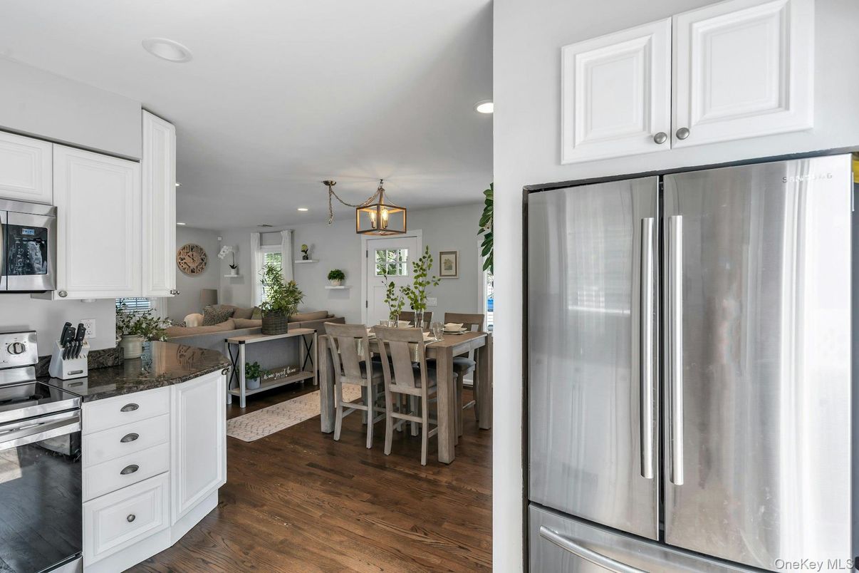 Dining room, Interior, Kitchen, Living room, Pendant Lights, Recessed Lighting, Stainless Steel Appliances, Wood Texture Flooring