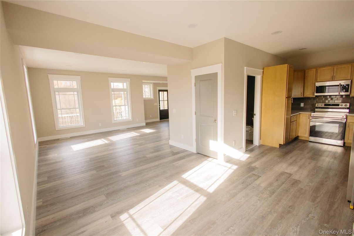 Empty room, Interior, Kitchen, Stainless Steel Appliances, Wood Texture Flooring