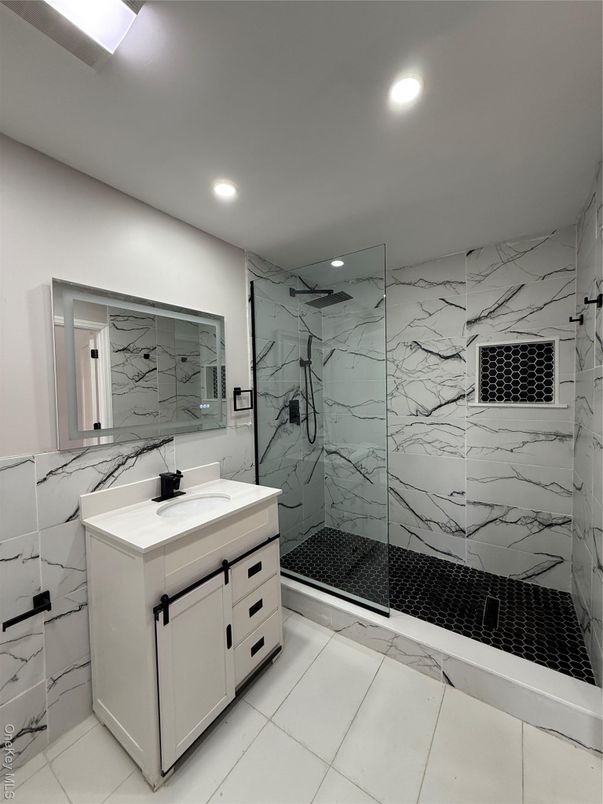 Bathroom, Dual Sink Vanities, Glass Shower, Interior, Marble Walls, Recessed Lighting