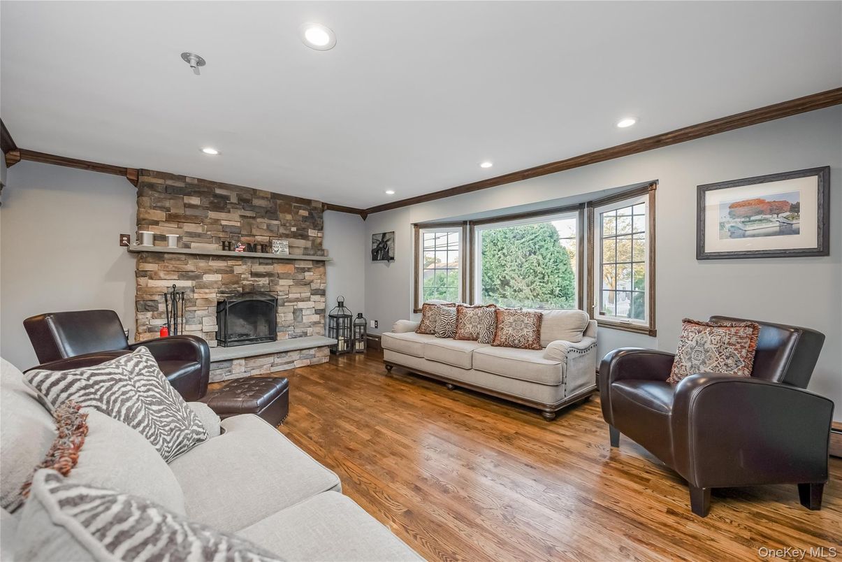 Fireplace, Interior, Living room, Recessed Lighting, Stone Walls, Wood Texture Flooring