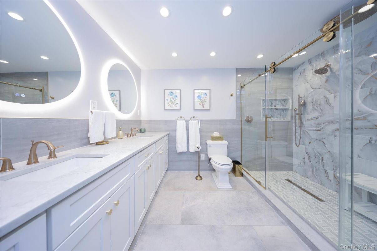 Bathroom, Dual Sink Vanities, Glass Shower, Interior, Marble Walls, Recessed Lighting