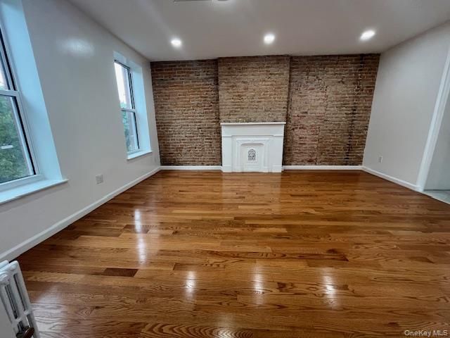 Empty room, Interior, Recessed Lighting, Stone Walls, Wood Texture Flooring