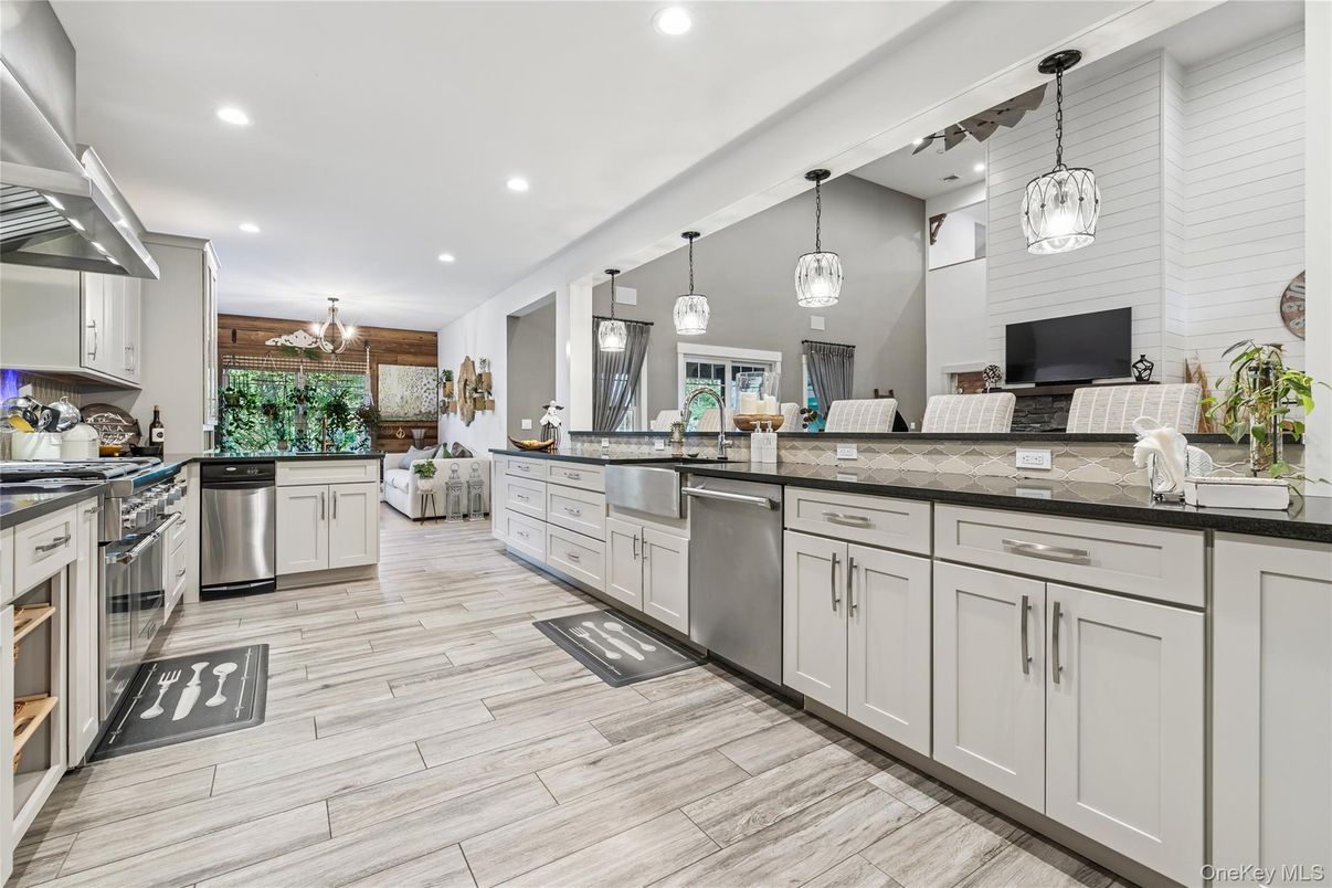 Chandelier, Interior, Kitchen, Pendant Lights, Recessed Lighting, Stainless Steel Appliances, Wood Texture Flooring