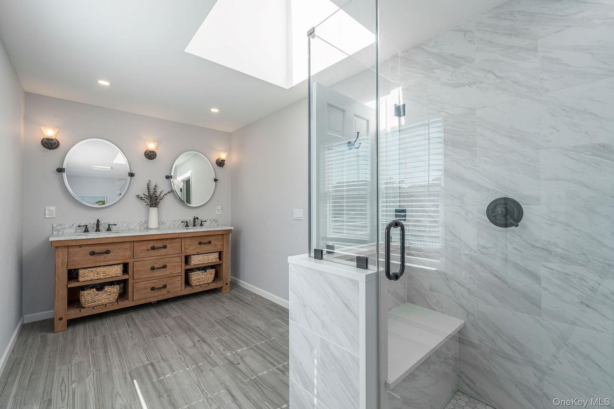 Bathroom, Dual Sink Vanities, Glass Shower, Interior, Marble Walls, Recessed Lighting