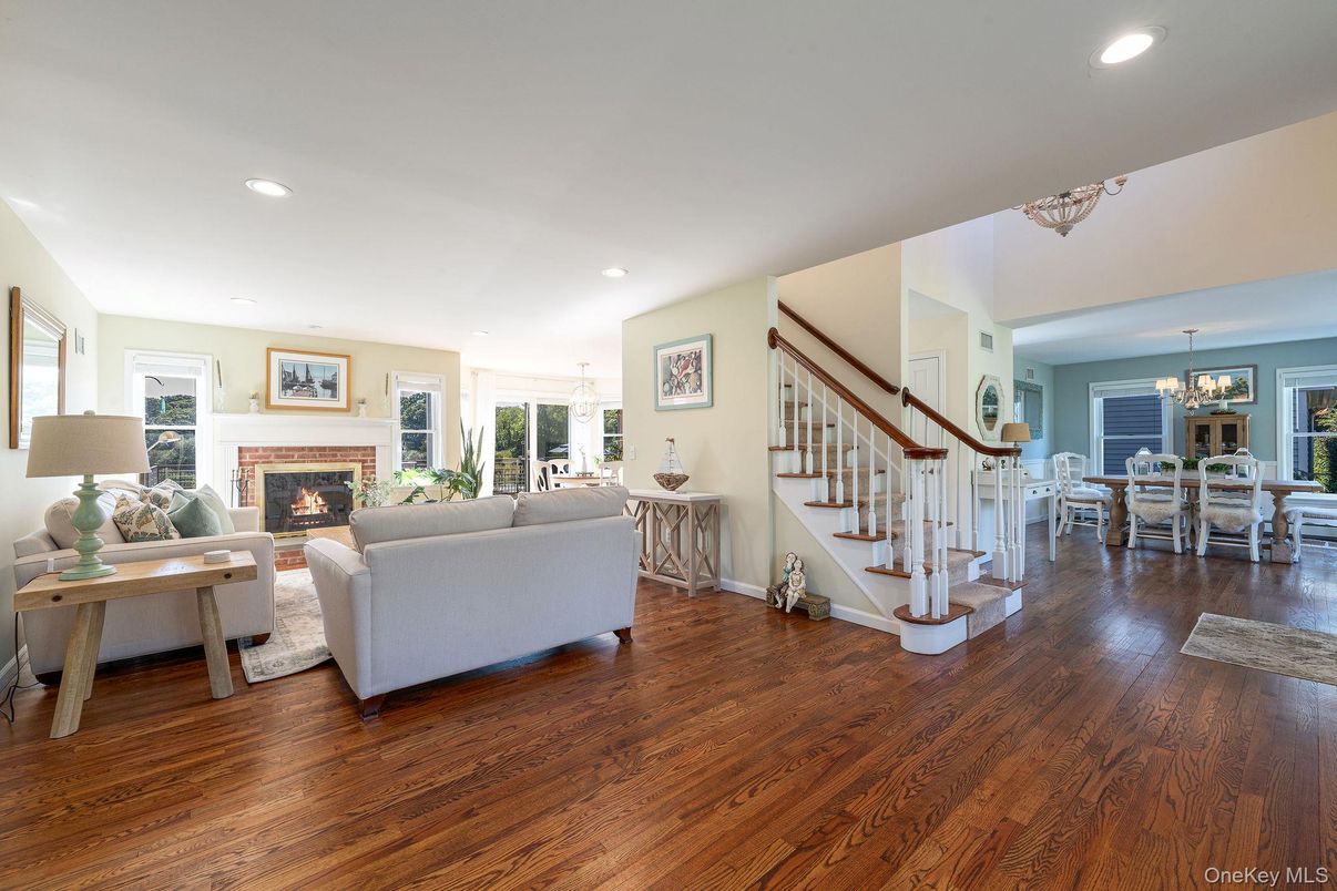Chandelier, Dining room, Fireplace, Interior, Living room, Recessed Lighting, Wood Texture Flooring