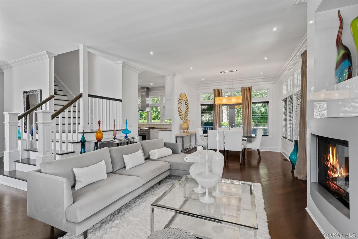 Dining room, Fireplace, Interior, Living room, Pendant Lights, Recessed Lighting, Wood Texture Flooring