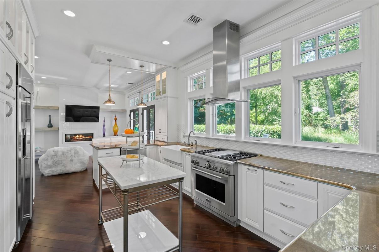 Fireplace, Interior, Kitchen, Living room, Pendant Lights, Recessed Lighting, Stainless Steel Appliances, Wood Texture Flooring