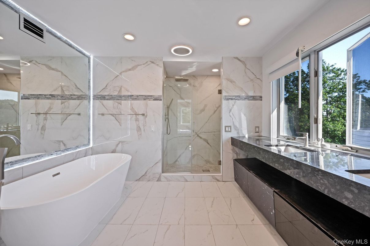 Bathroom, Dual Sink Vanities, Free Standing Baths, Glass Shower, Interior, Marble, Marble Walls, Recessed Lighting