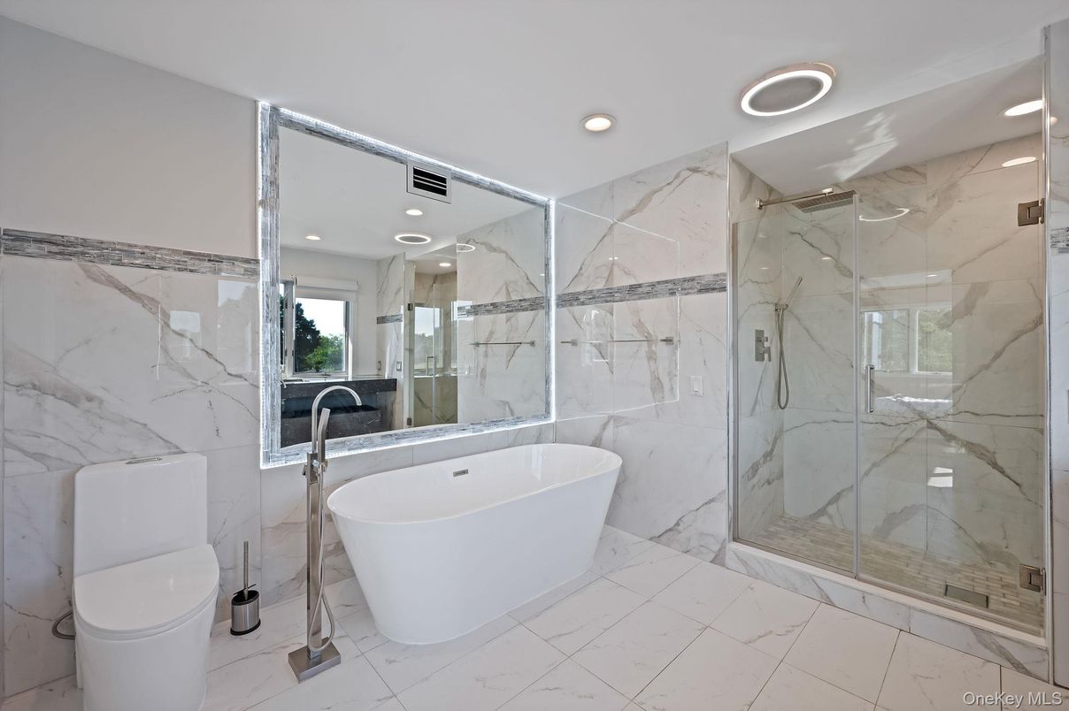 Bathroom, Free Standing Baths, Glass Shower, Interior, Marble, Marble Walls, Recessed Lighting