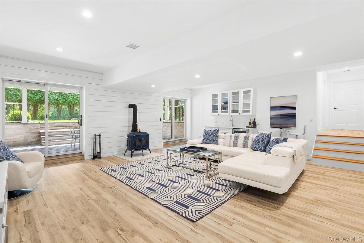 Fireplace, Interior, Living room, Recessed Lighting, Stone Walls, Wood Texture Flooring