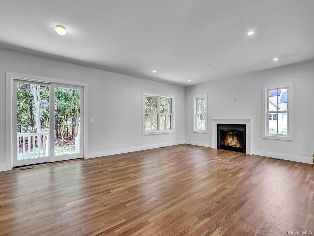 Empty room, Fireplace, Interior, Recessed Lighting, Wood Texture Flooring