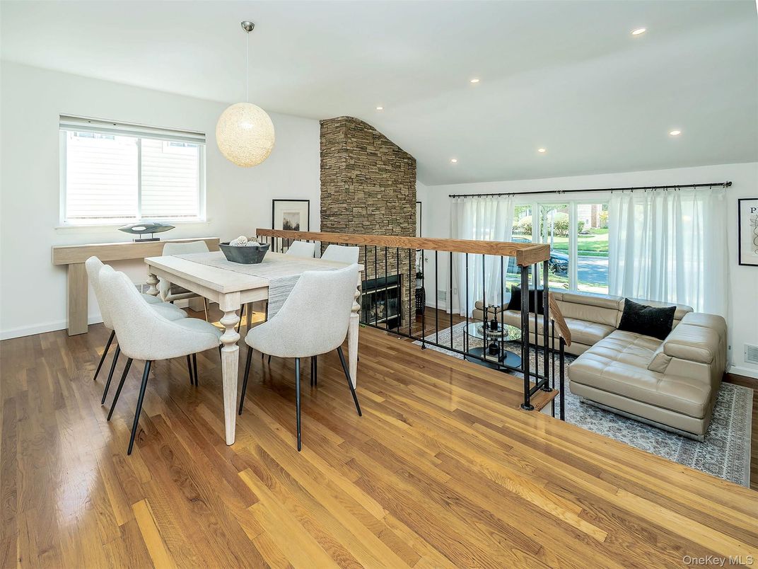 Dining room, Fireplace, Interior, Pendant Lights, Recessed Lighting, Stone Walls, Wood Texture Flooring