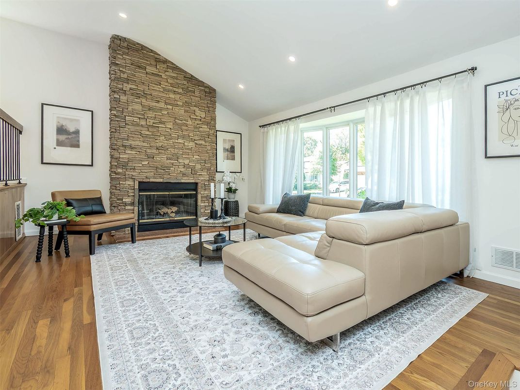 Fireplace, Interior, Living room, Recessed Lighting, Stone Walls, Wood Texture Flooring