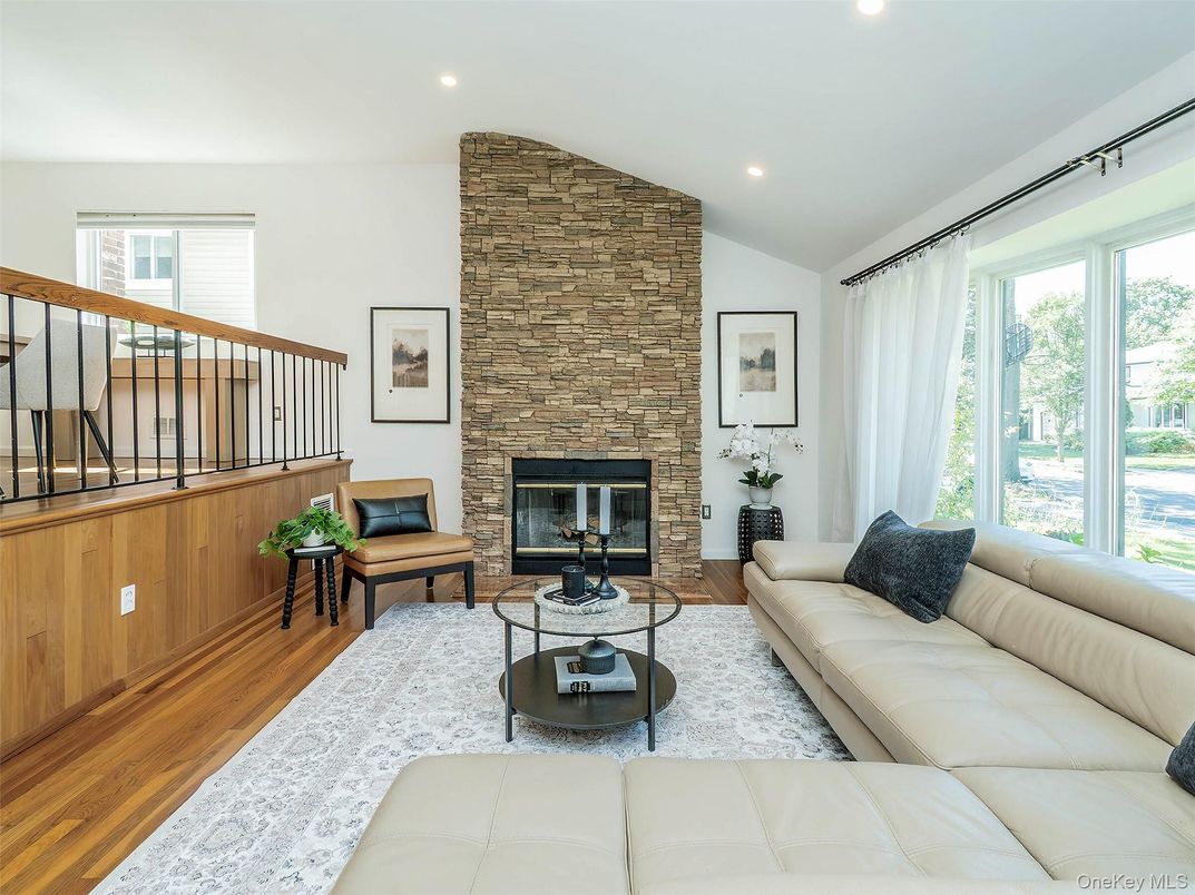 Fireplace, Interior, Living room, Recessed Lighting, Stone Walls, Wood Texture Flooring
