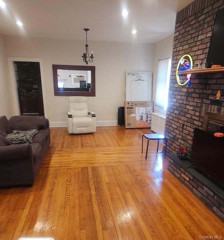 Fireplace, Interior, Living room, Pendant Lights, Recessed Lighting, Stone Walls, Wood Texture Flooring